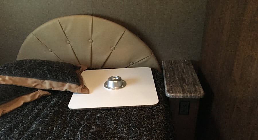 This is an example of the poor job of interior design they did with the Coach. The headboard looks really cheesy. Like a teenager wrapped some vinyl around a semi-circle of cardboard and stapled it to the wall behind the bed!