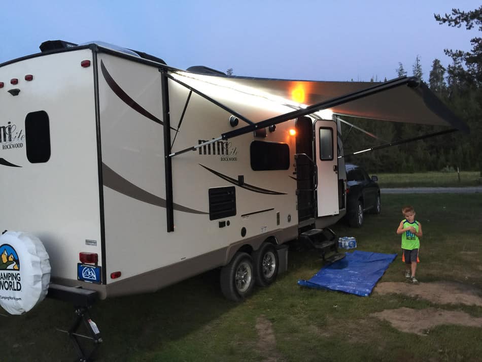 Travel Trailer at campground at dusk.