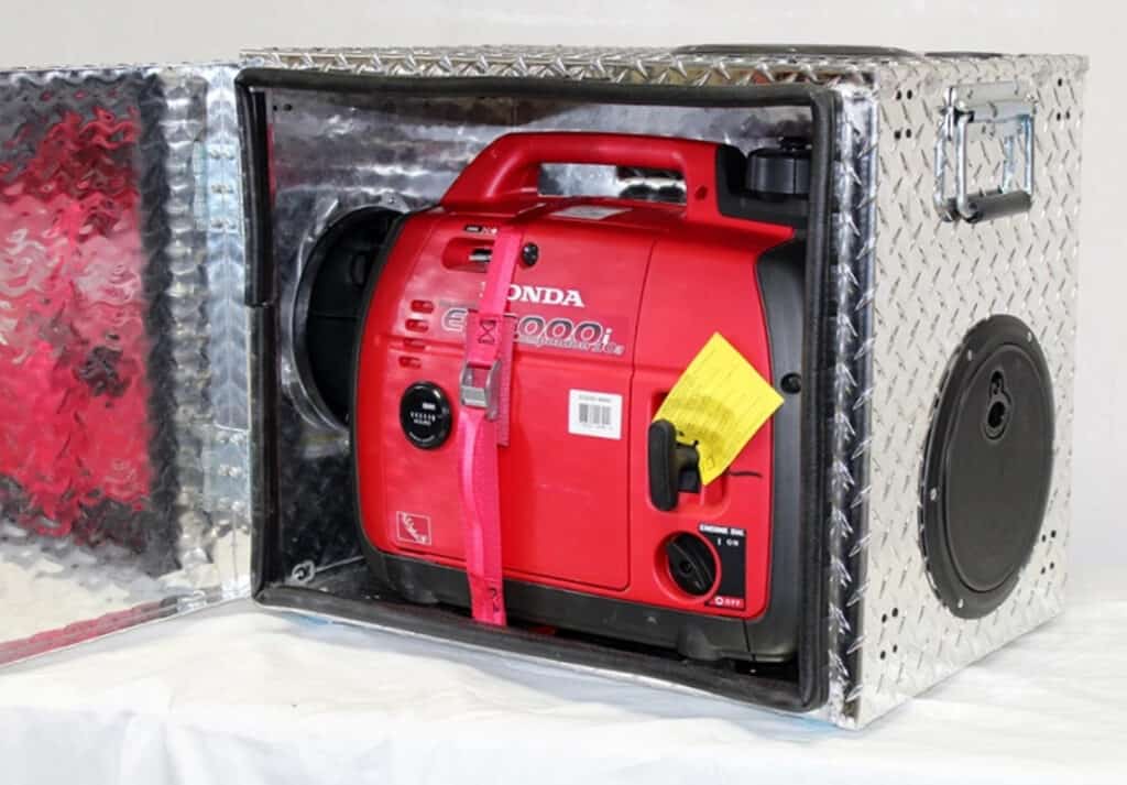 Small generator in a sound deadening box.