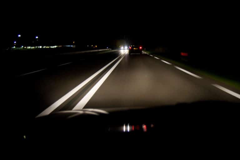 Dark highway with approaching lights