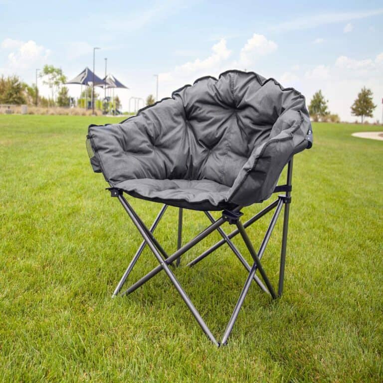 A typical folding camping chair in a grass field.