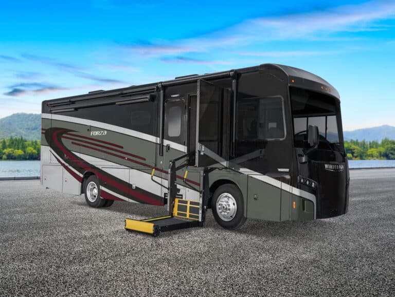 Wheelchair accessible motorhome on dealer lot with lift opened.