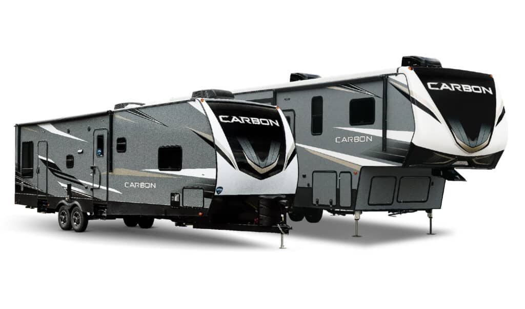 A Keystone Carbon Travel Trailer and 5th wheel on display in stock photo.