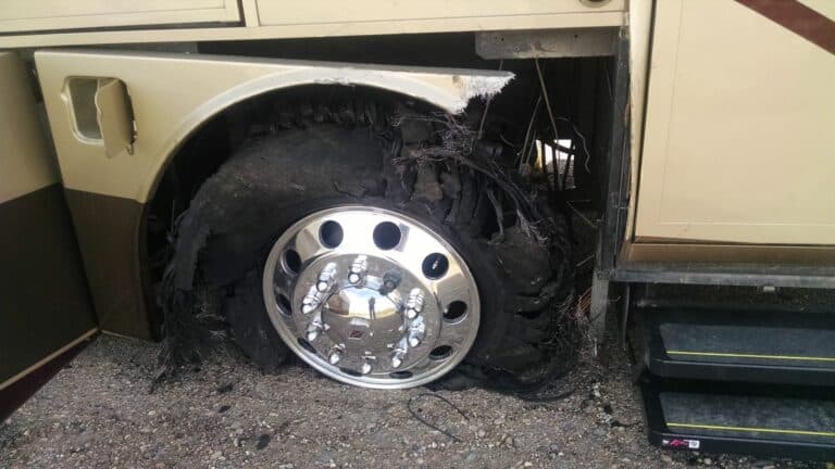 Shredded front tire on a motorhome.