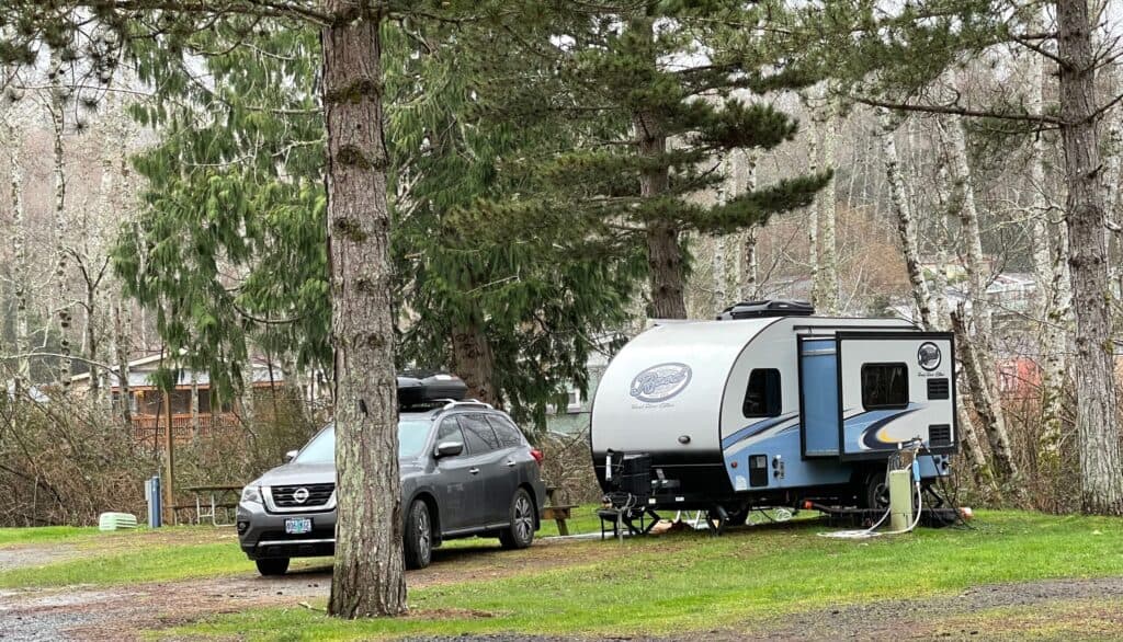 Travel trailer parked at campsite