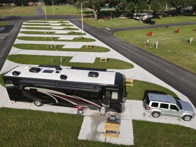 Aerial shot of Oak Alley RV Resort with Class A motorhome in foreground.