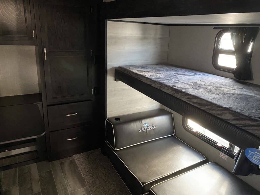 View inside an RV with bunk beds.