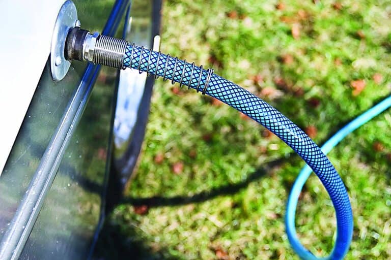 RV water hose connected to motorhome - feature image for best RV water hoses