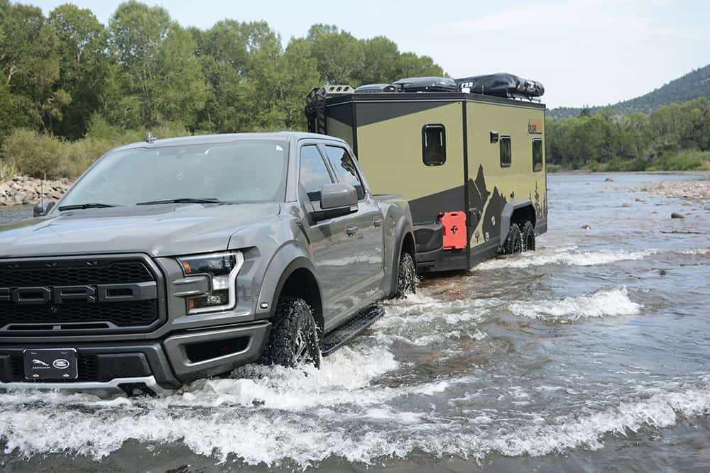 view of the XploreRV XR22 By Imperial Outdoors driving through water
