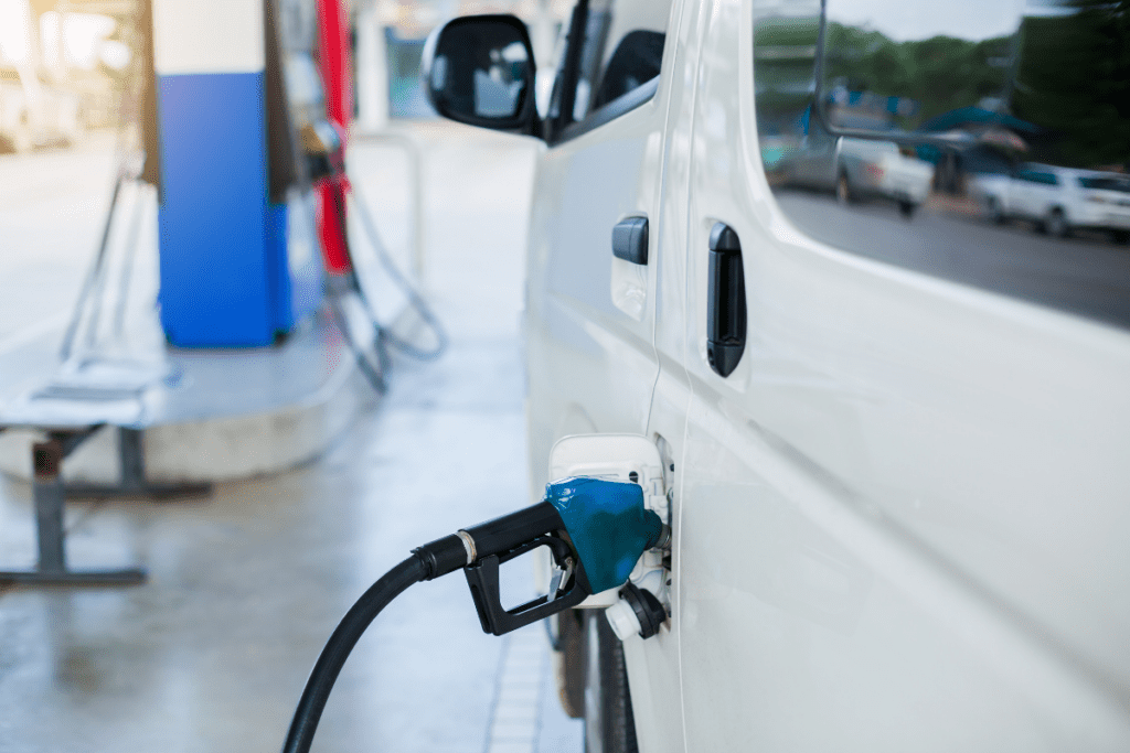 Van fueling up at a gas pump - RV van rental