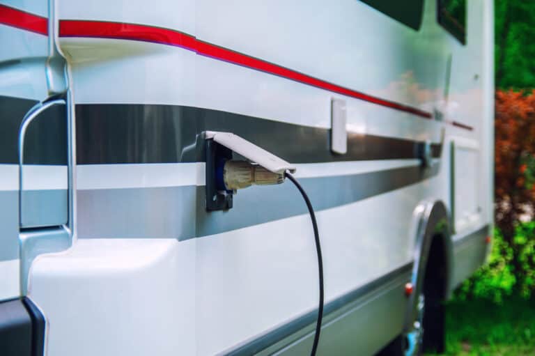 RV plugged in with an RV voltage regulator