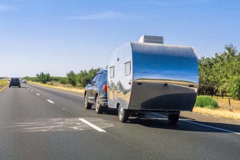 car towing a travel trailer - feature photo for Campers You Can Tow With A Car