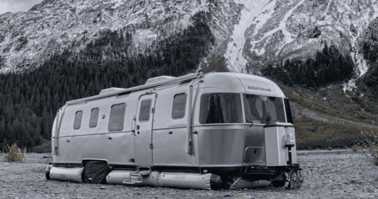 airstream camper in mountainous terrain fitted with airskirts