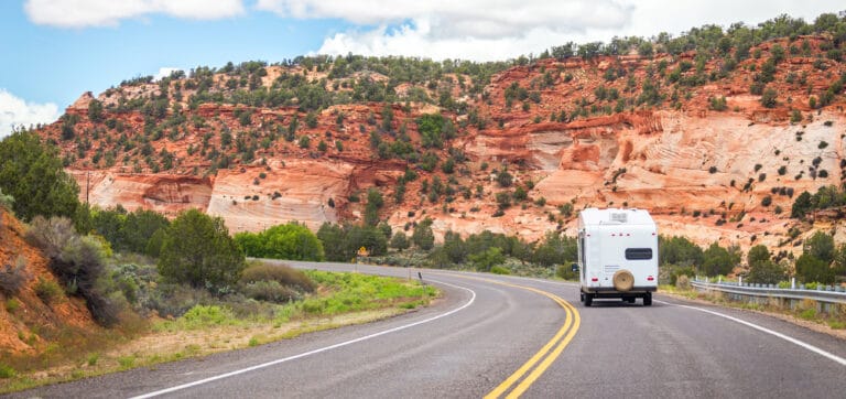 RV on the road in Utah - feature photo for How To Get The Best Deal On An RV
