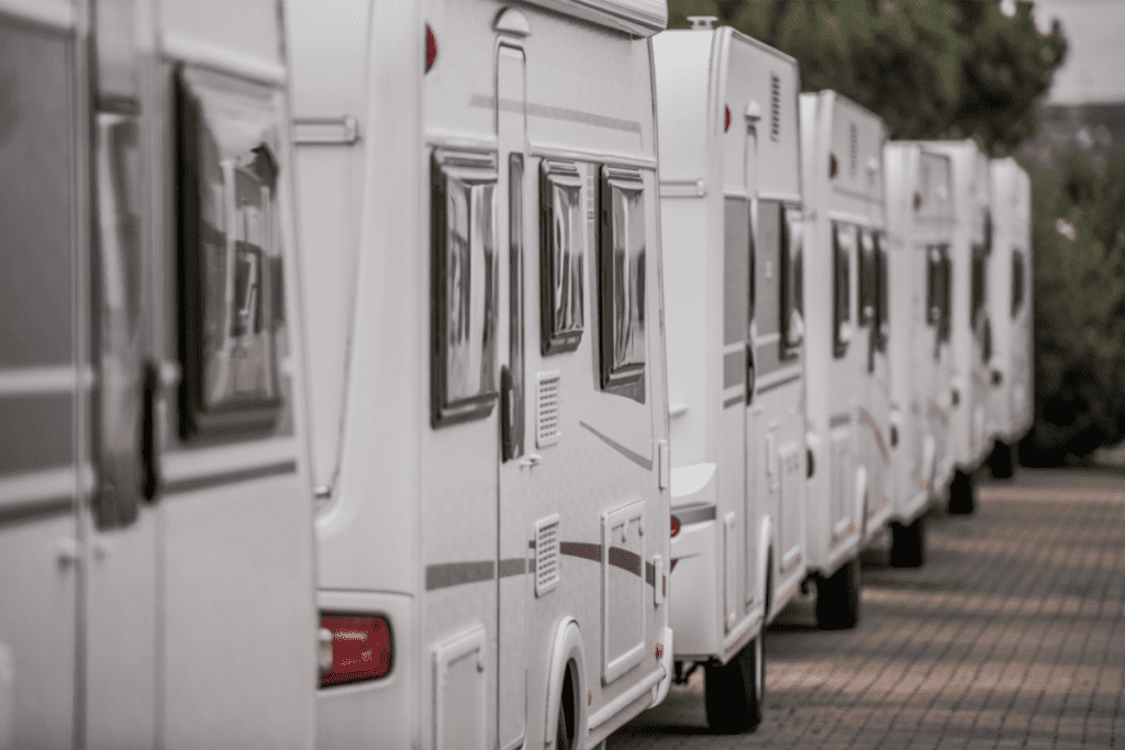 A row of RVs parked at a dealership