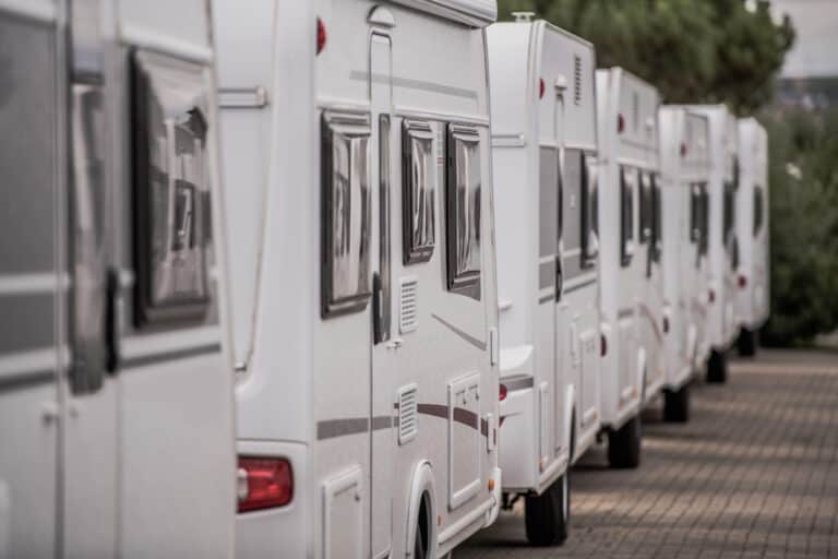 RVs lined up at an RV dealer - feature image for Where To Buy An RV With Bad Credit
