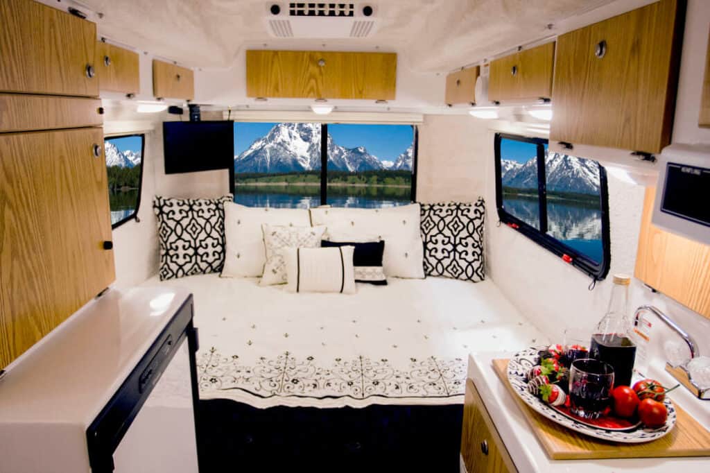 dining area inside of a small camper - feature image for Small RVs With King Beds