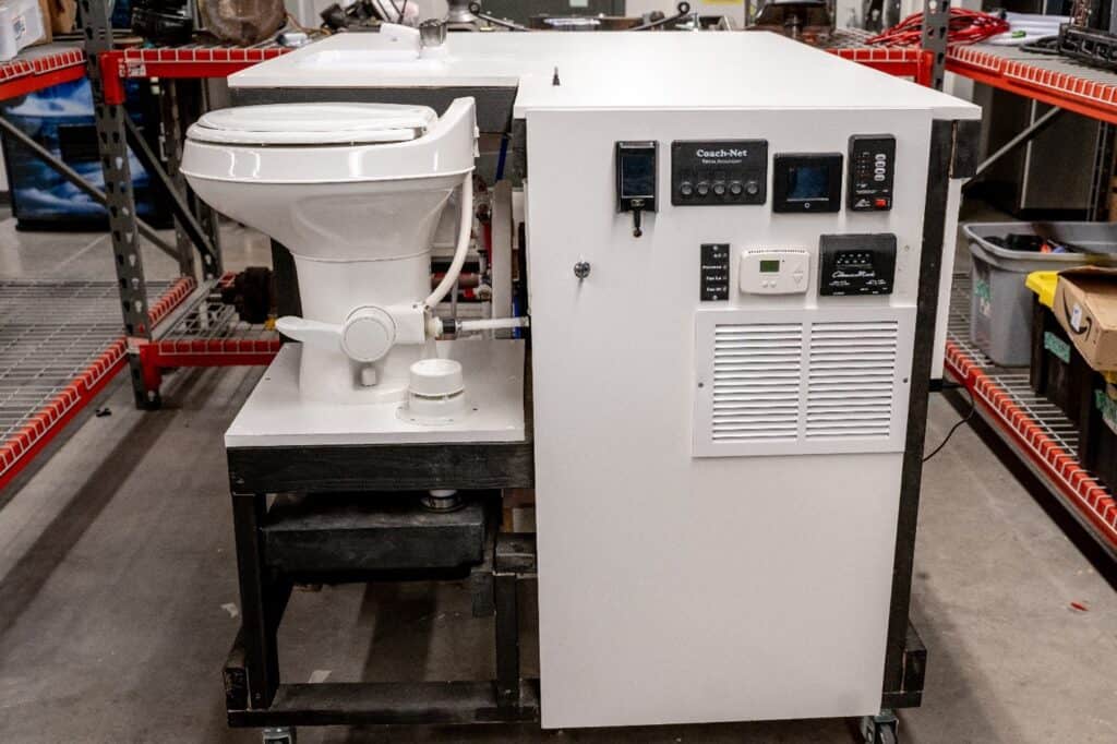 a side view of an rv training table which includes an rv toilet.