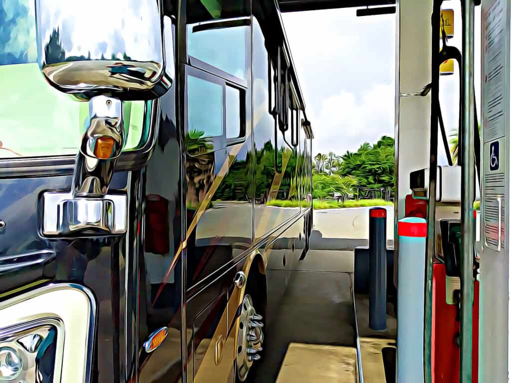 motorhome at gas station - feature image for How To Save Money On Fuel