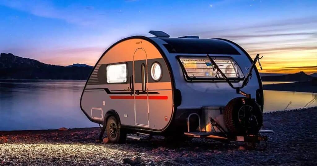 nucamp RV at sunset - feature image for  What Is The Best Travel Trailer For The Money?