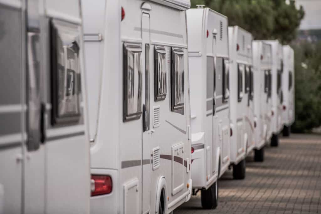 RVs at dealership lined up - feature image for can I buy an RV with no money down