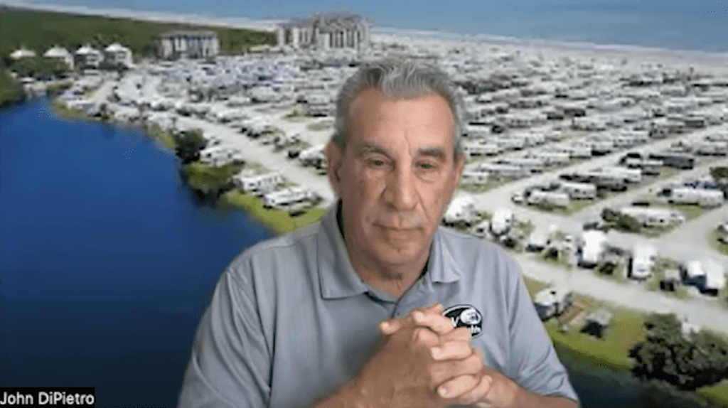 John DiPietro of the RV industry show, Camper Report, shown with a campground backdrop.