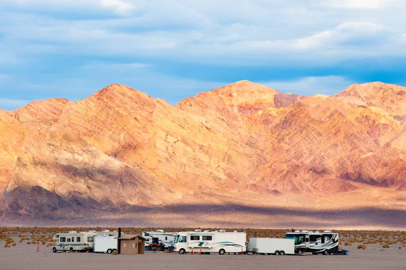 RVs in front of landscape - feature image for private RV parks near national parks
