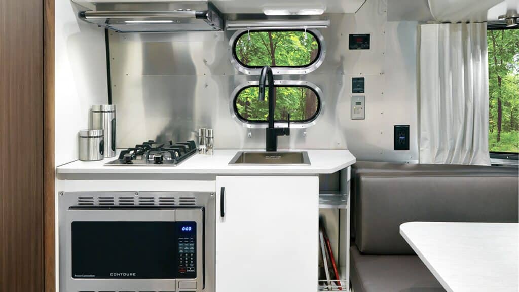 Caravel travel trailer kitchen including convection oven and microwave