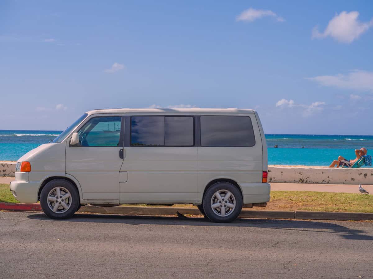 camper van near beach , feature image for how to rent an RV in hawaii