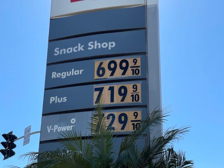 closeup of gas station sign prices - feature image for unleaded vs premium