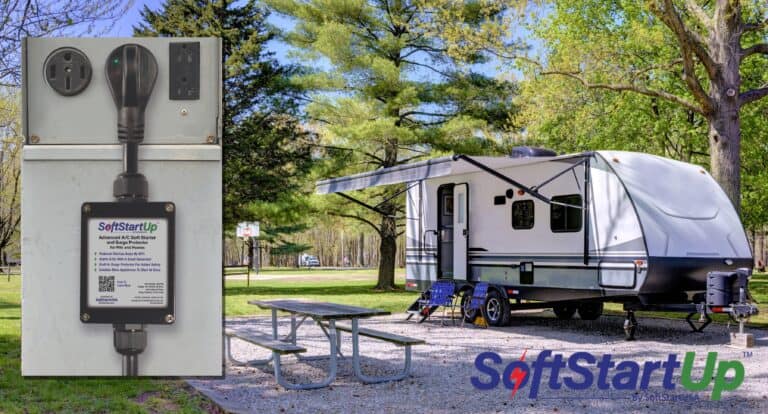SoftStartUp plugged into campground pedestal at site with travel trailer and picnic table