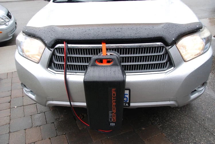 CarGenerator hanging on the front of a vehicle.
