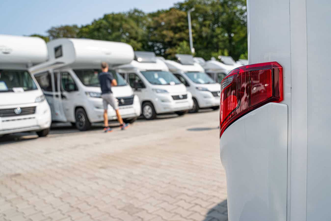 Line of Brand New Motorhomes Awaiting Clients on Dealership Sales Lot. Recreational Vehicles Selling. Caravanning Industry - feature image for RV recalls