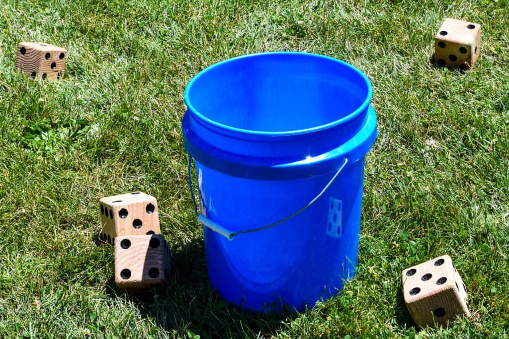 blue five gallon bucket with dice - feature image for yard games