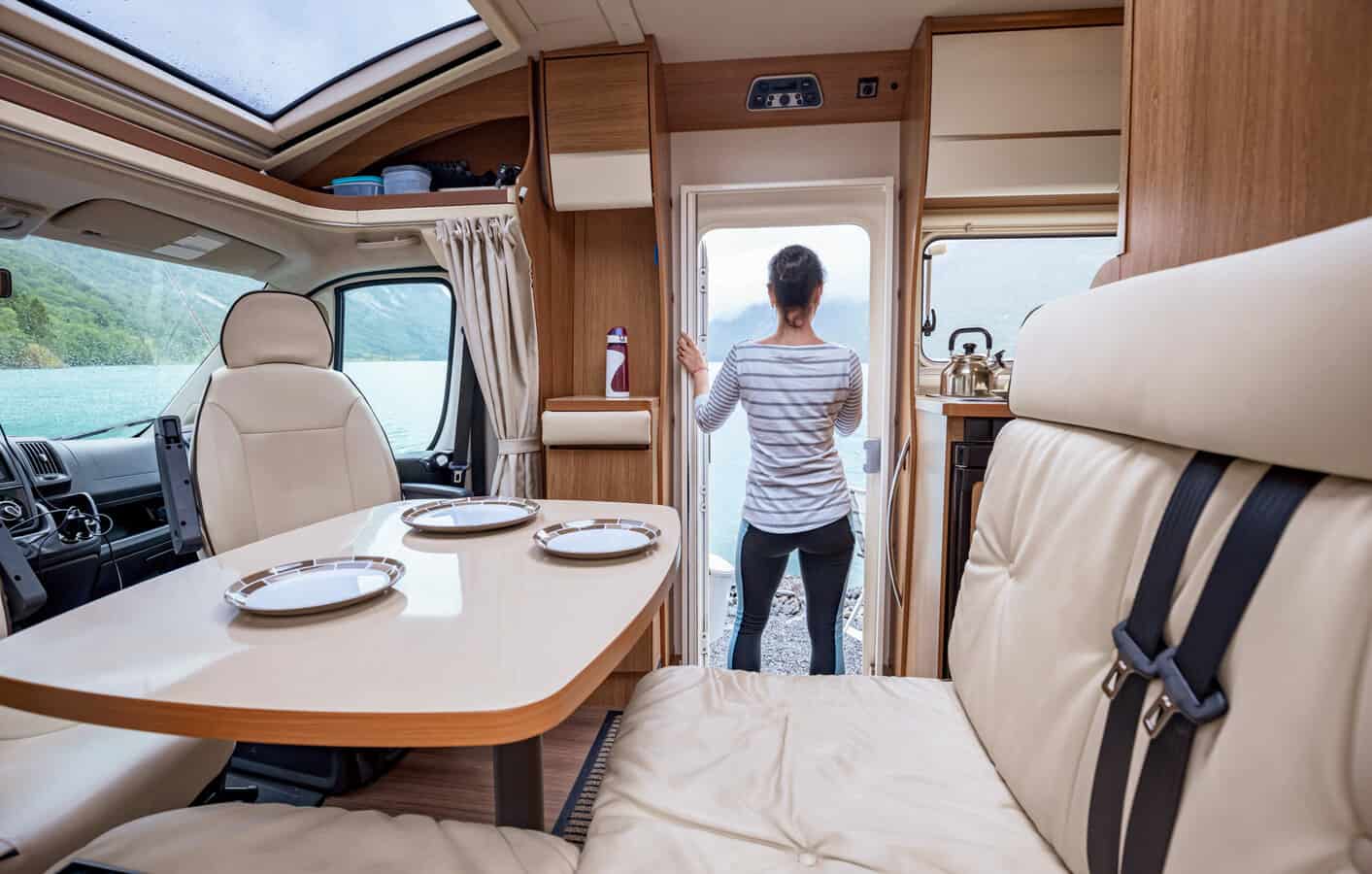 woman standing in RV - feature image for signs you're getting sick