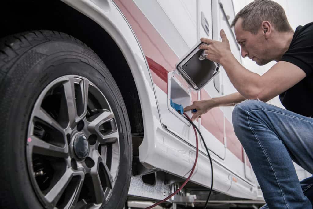 closeup of RV inspectors working on vehicle