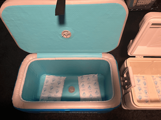 open airskirts cooler with ice packs inside.