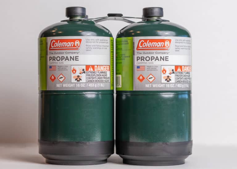 2 single use propane cylinders on gray background
