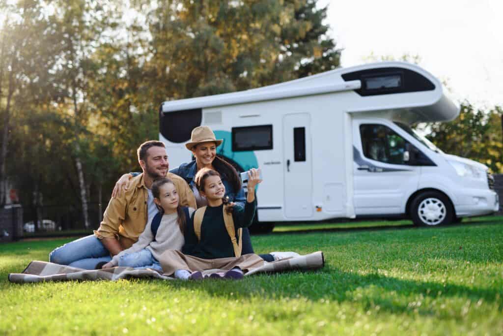 family in front RV, feature image for family trip ideas