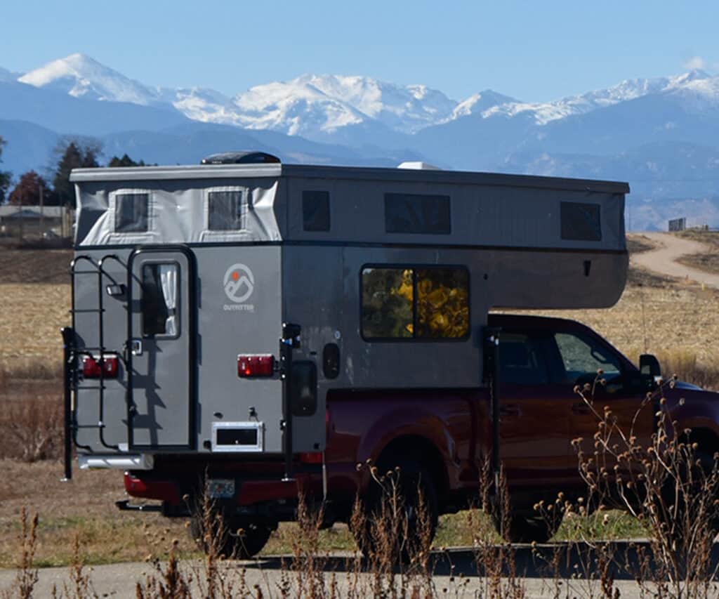lightweight truck campers with mountains in background