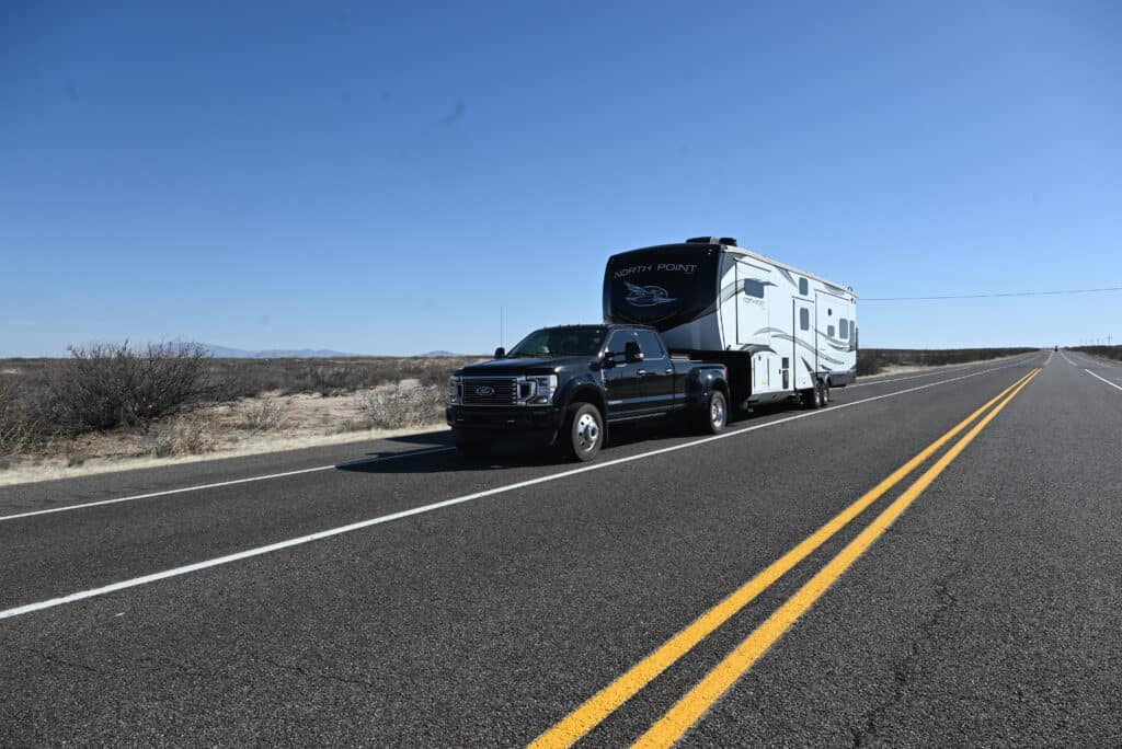 RV on highway, featured image for worst states for camping data analysis