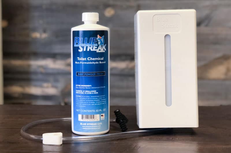 The Blue Streak Chemical Dispenser with one bottle of toilet chemical.