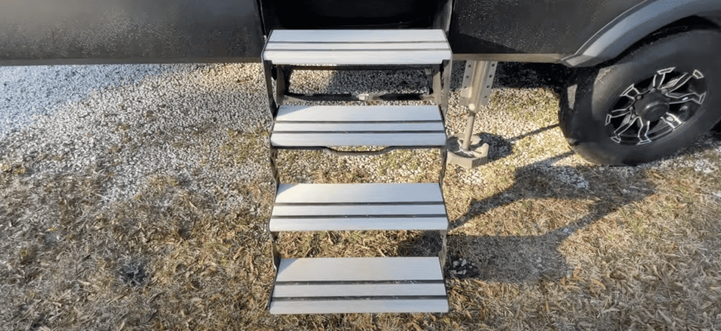 OEM rv entry steps extended from a 5th wheel.