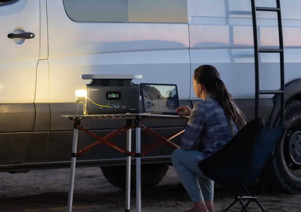 Woman uses the Growatt INFINITY 1300 outside her camper van