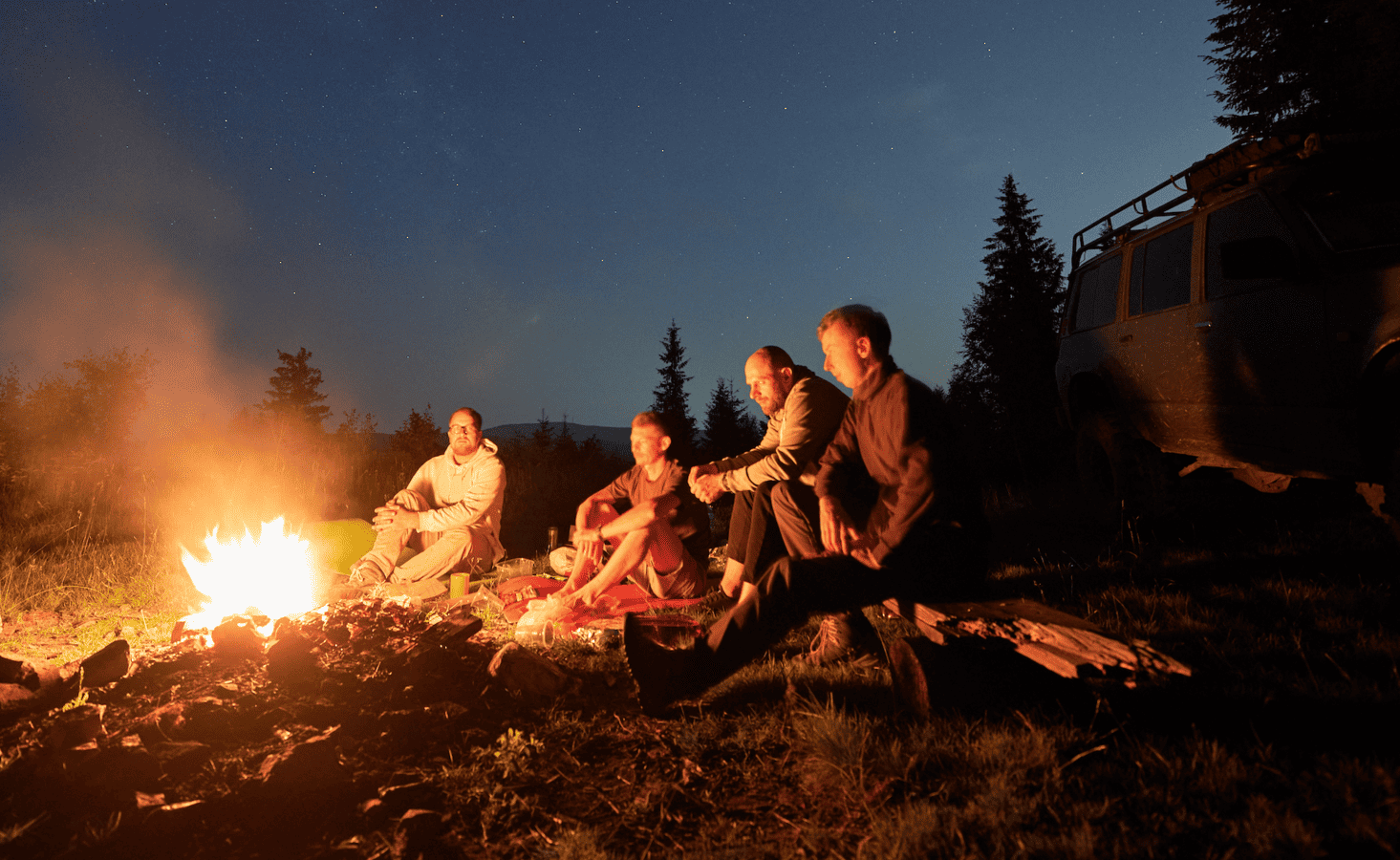 RV Family around fire enjoying the campfire smell