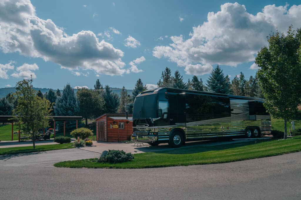 An RV site with a parked motorhome at StoneRidge Motorcoach resort.