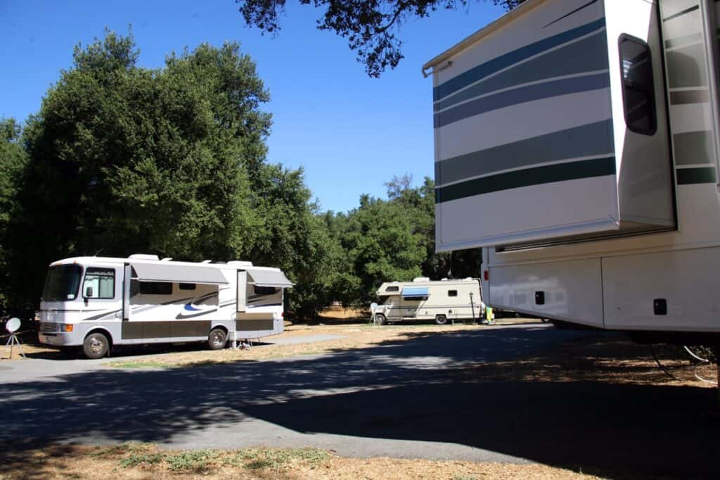 Class A motohomes parked in a campground, as they would be in an FMCA rally.
