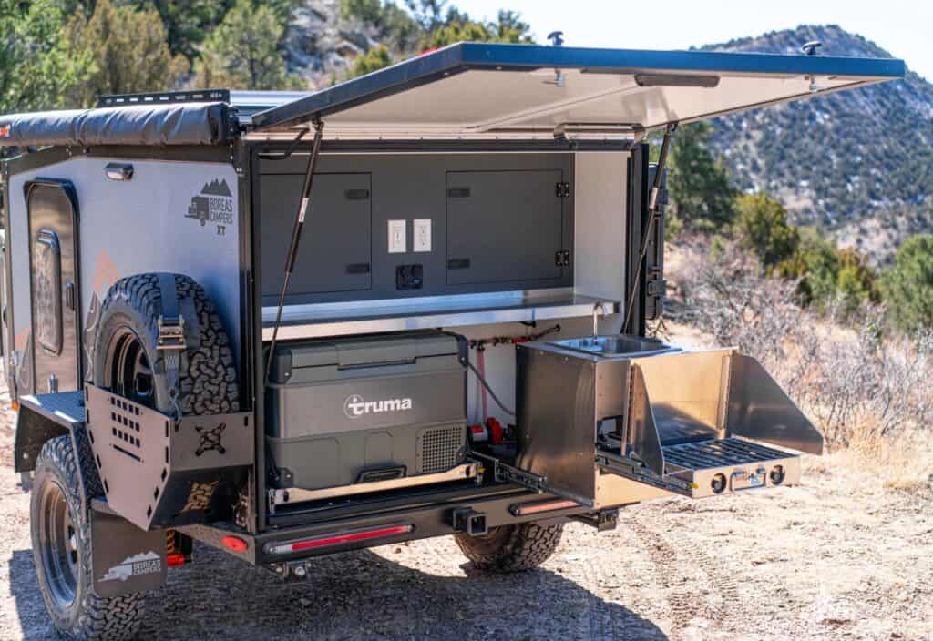 Boreas XT off-road trailer rear kitchen, with Truma ice chest and fold-out propane stove and stainless-steel sink. Photo: Boreas Campers..