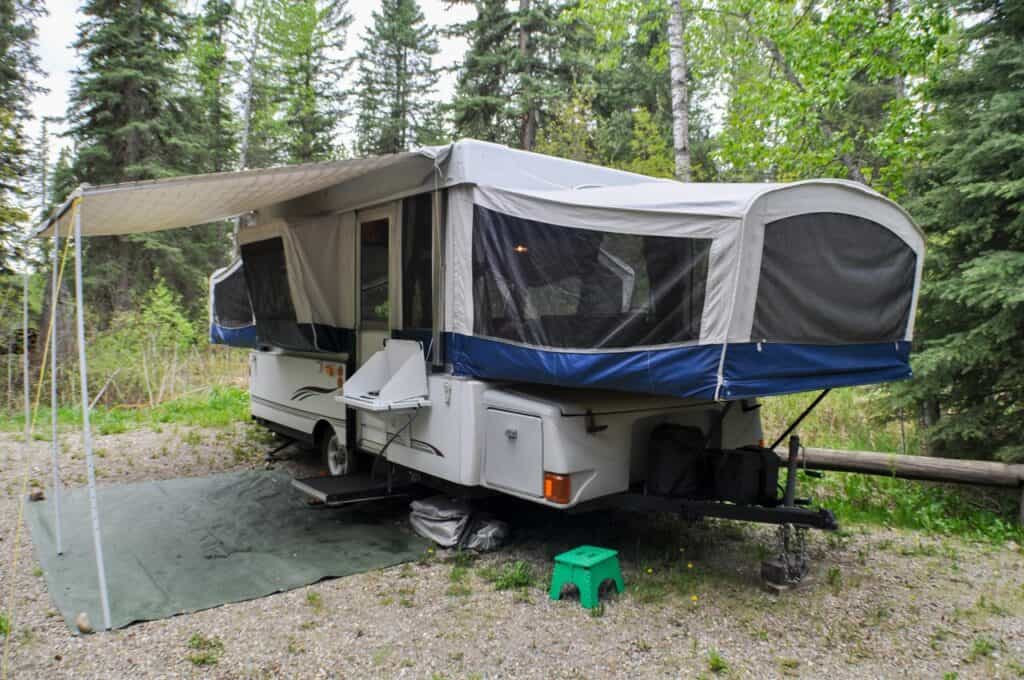 A pop-up trailer in the woods. Shutterstock.